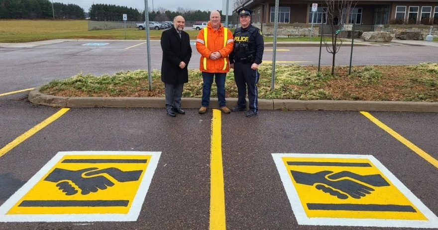 Here’s what a handshake symbol on a parking space means