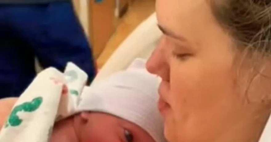 A Newborn RAISES His Head to Look at His Mom