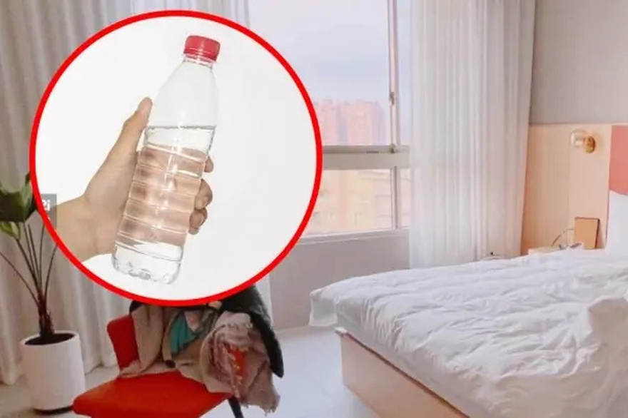 Why You Should Toss a Water Bottle Under Your Hotel Bed Right After You Check In