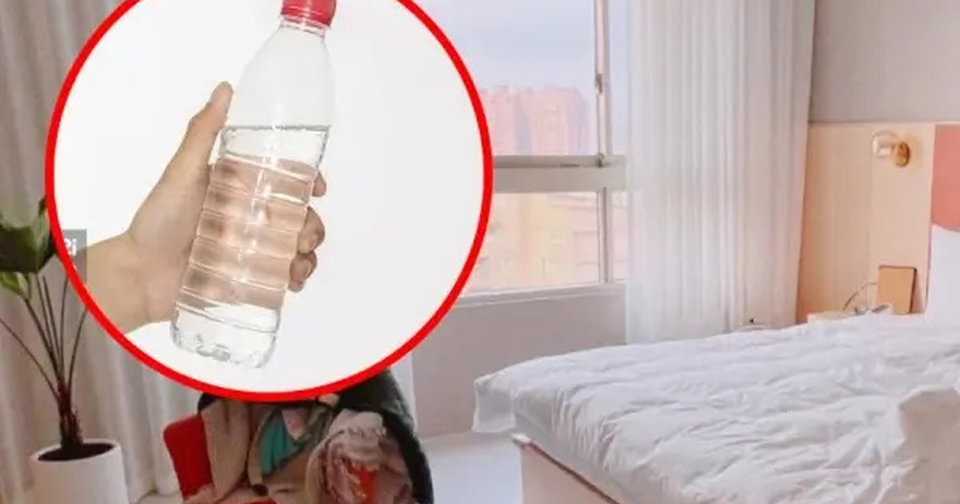 Why You Should Toss a Water Bottle Under Your Hotel Bed Right After You Check In