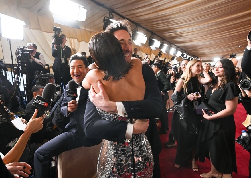 Why Halle Berry was seen kissing Adrien Brody on Oscars red carpet… in front of his girlfriend