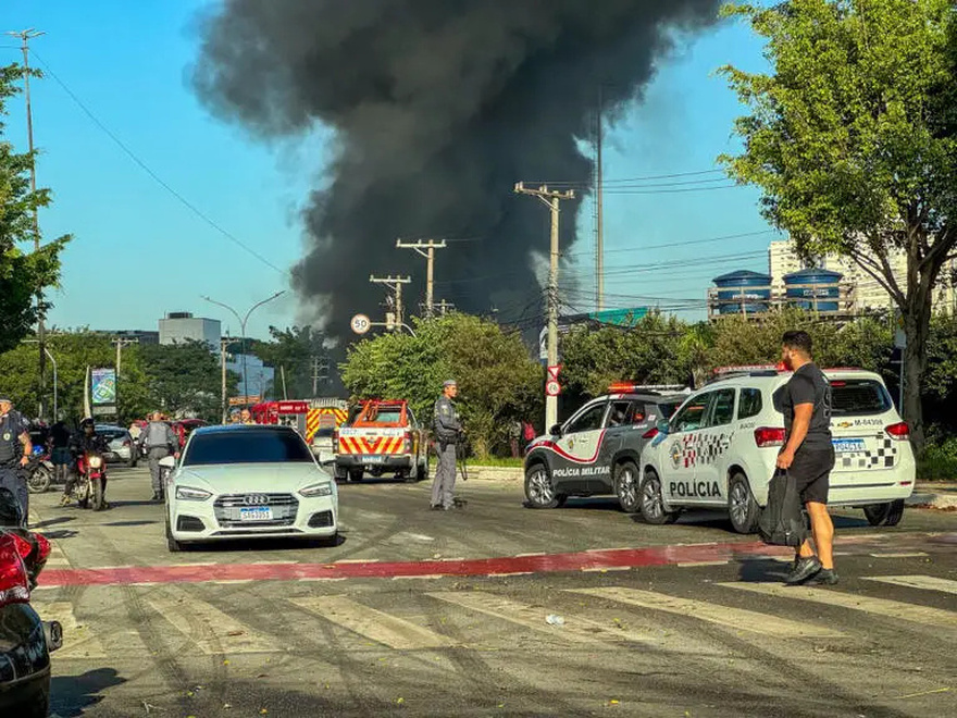 In a bustling district, a small plane crashed into a bus and exploded