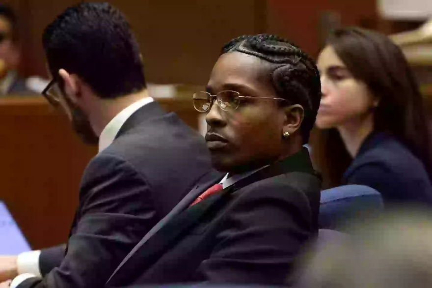 Emotional moment A$AP Rocky leaps behind court benches to Rihanna after verdict is read out during trial